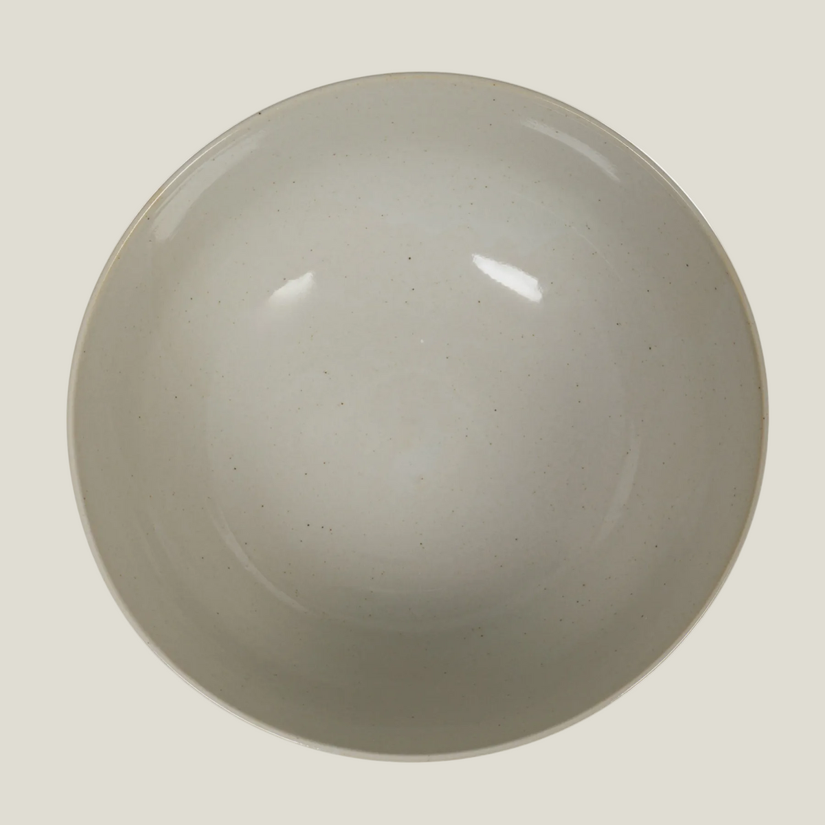 The Hampton Bloom Bowl seen from above, showing its plain speckled off-white glazed interior