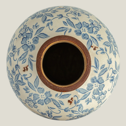 Top view of the blue and cream transferware terra-cotta vase showing its opening and floral pattern