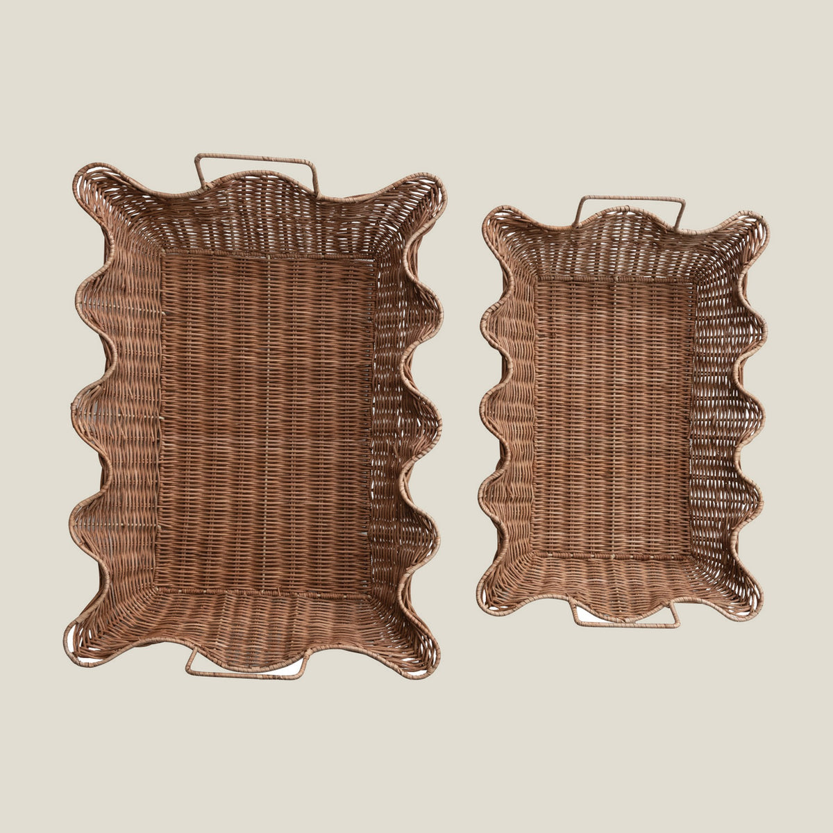 Two scalloped rattan nesting trays seen from above
