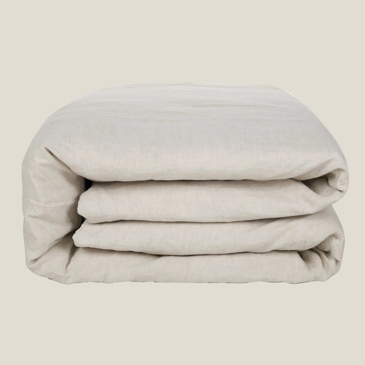 Natural linen duvet cover in greige, neatly folded
