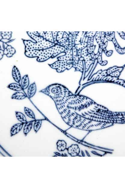 Close-up of the hand-drawn cobalt blue bird and leaf pattern on the Delft Garden Bowl
