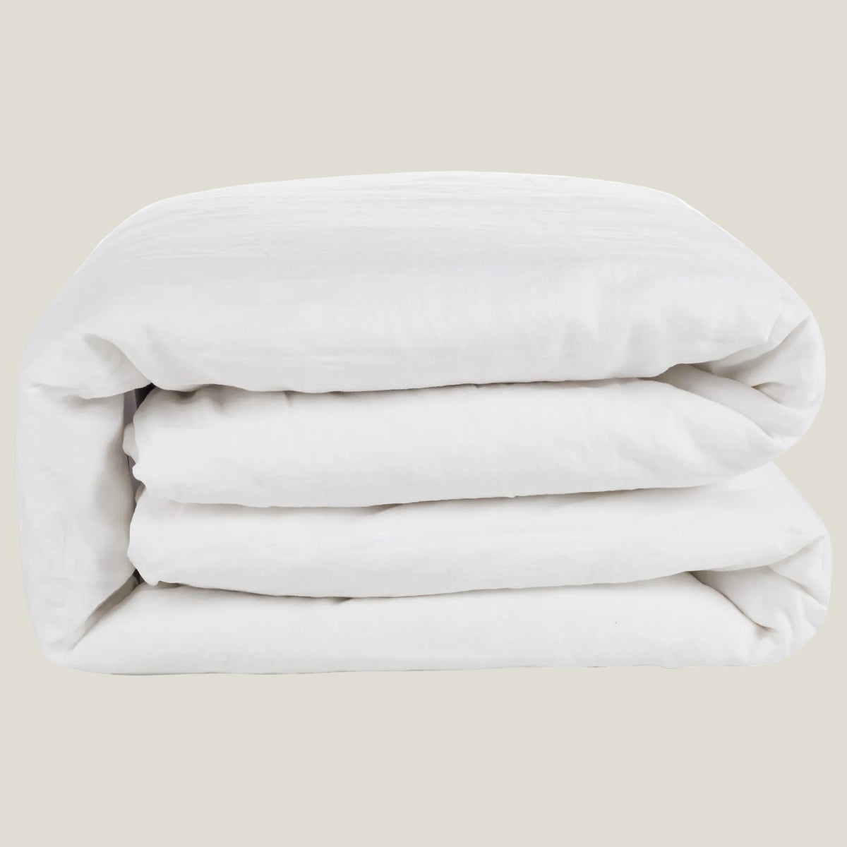 Natural linen duvet cover in soft white, neatly folded