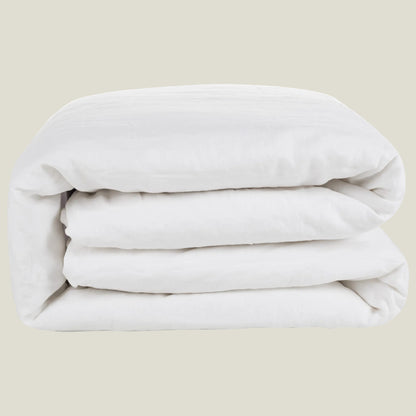 Natural linen duvet cover in soft white, neatly folded