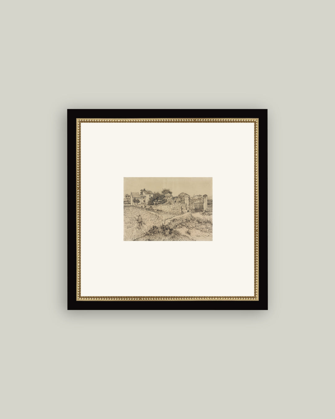 The Tuscan Village sepia sketch art print on a cream mat in a black frame with gold beaded inner edge, on a soft grey wall