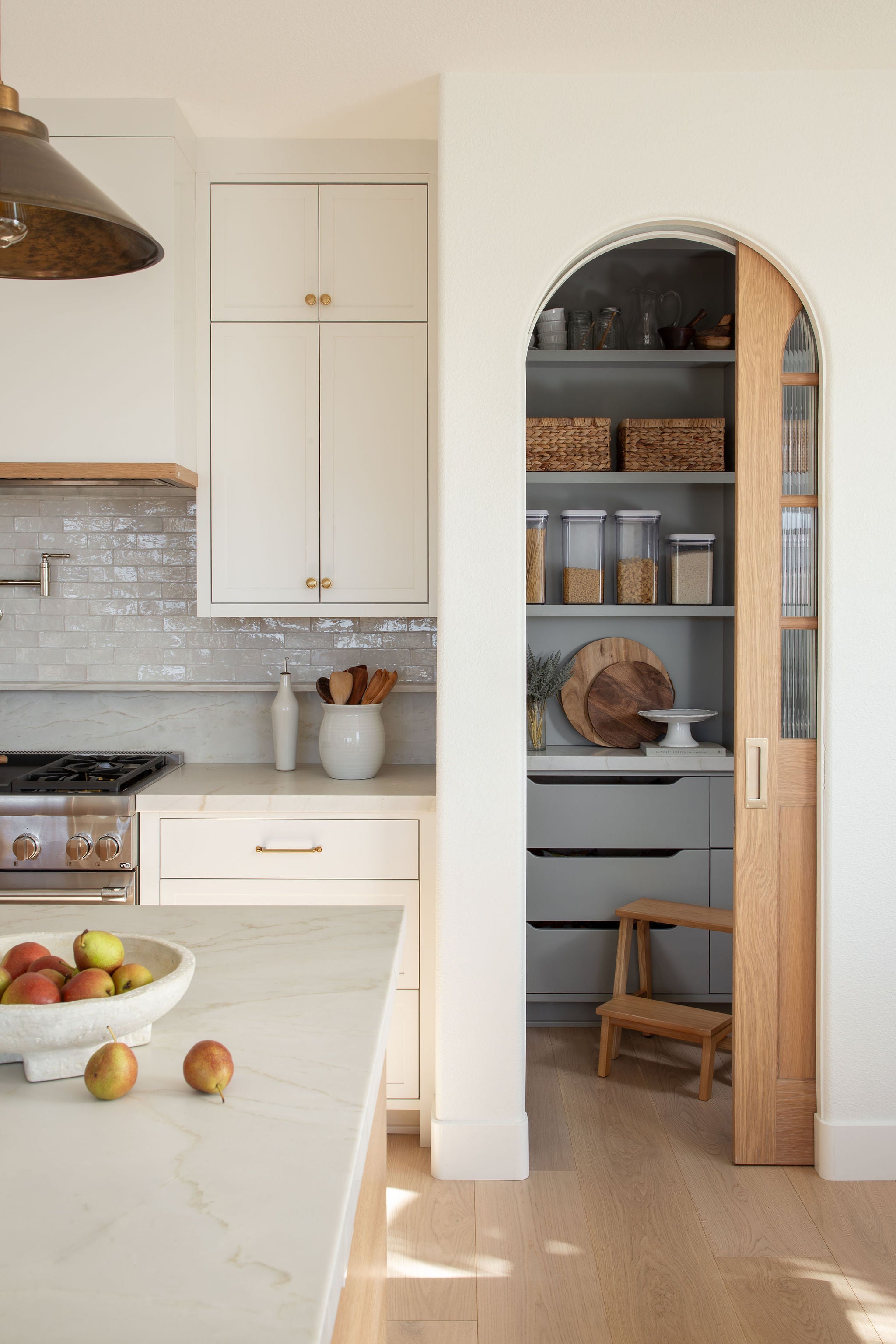 Hand-built sliding pocket door at the entrance to the Crystalline Project pantry