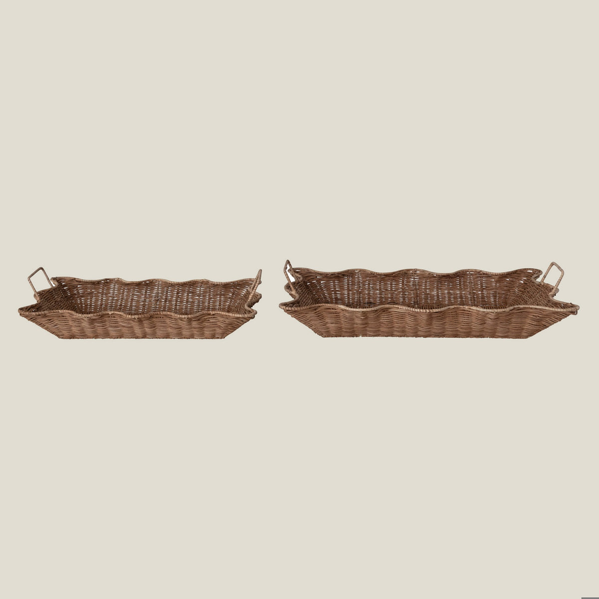 Scalloped rattan nesting trays side by side, side view