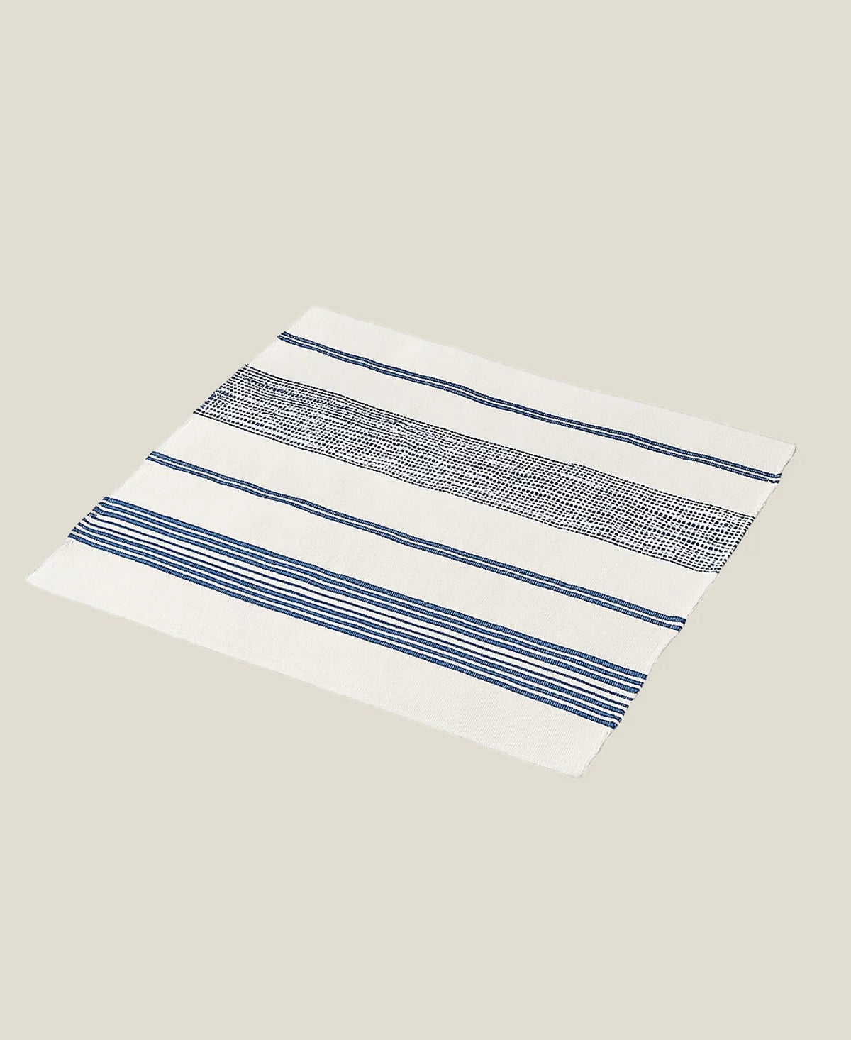 The Aden bath mat laid flat at an angle