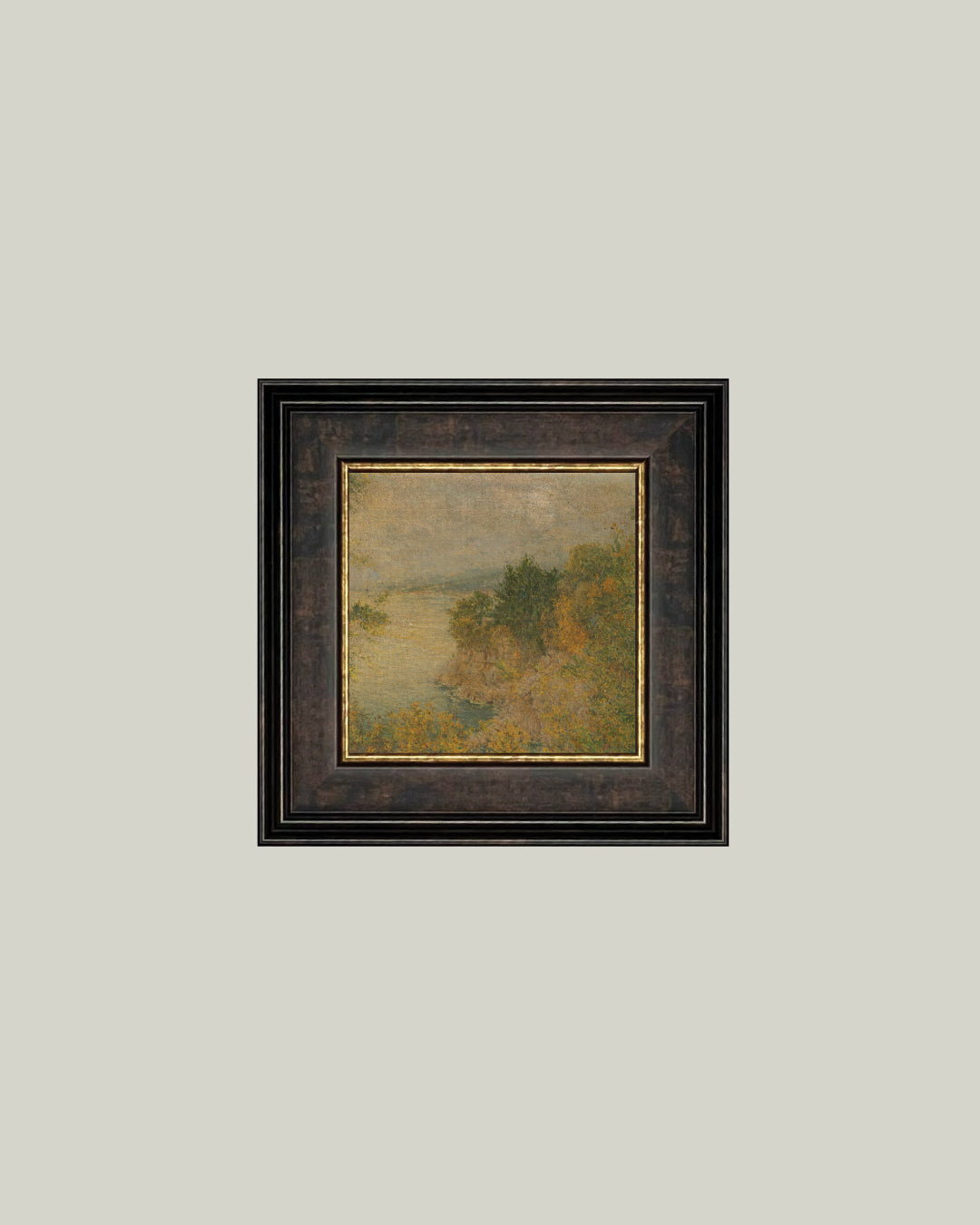 The Autumn Landscape square art print of a hazy golden landscape in a dark frame with gold inner edge, hung on a soft grey wall