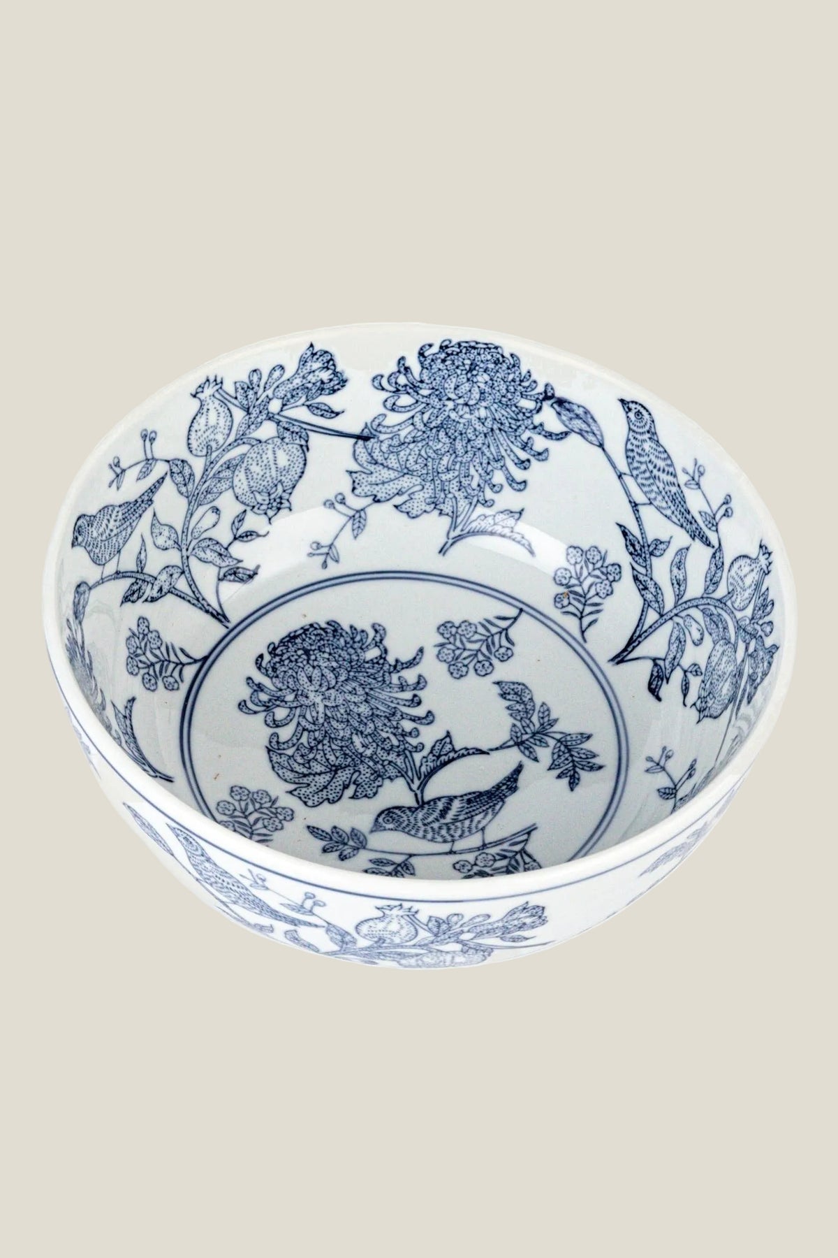 The Delft Garden Bowl seen from above, showing the blue chrysanthemum medallion and birds painted inside the white stoneware