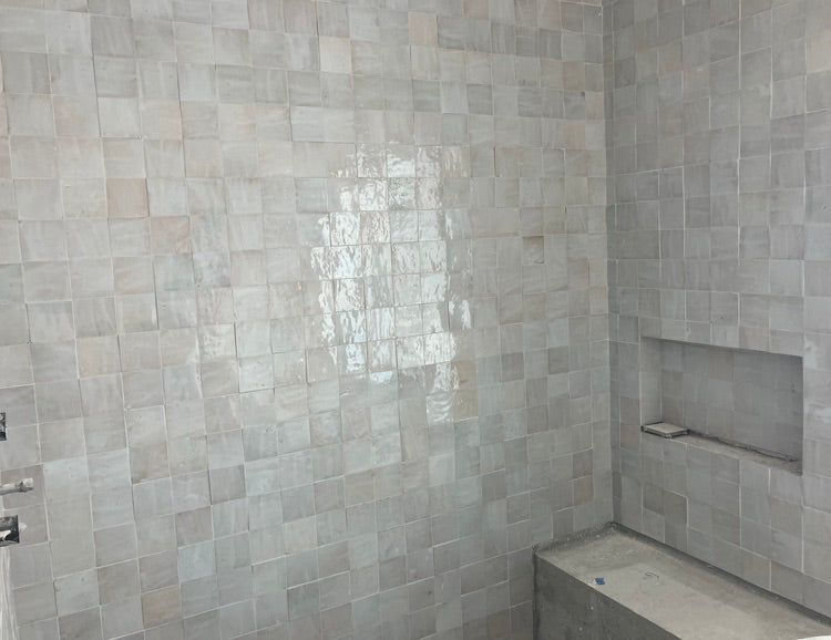 Dover Shores Project primary bathroom 4x4 glazed zellige shower tile with built-in bench and recessed niche