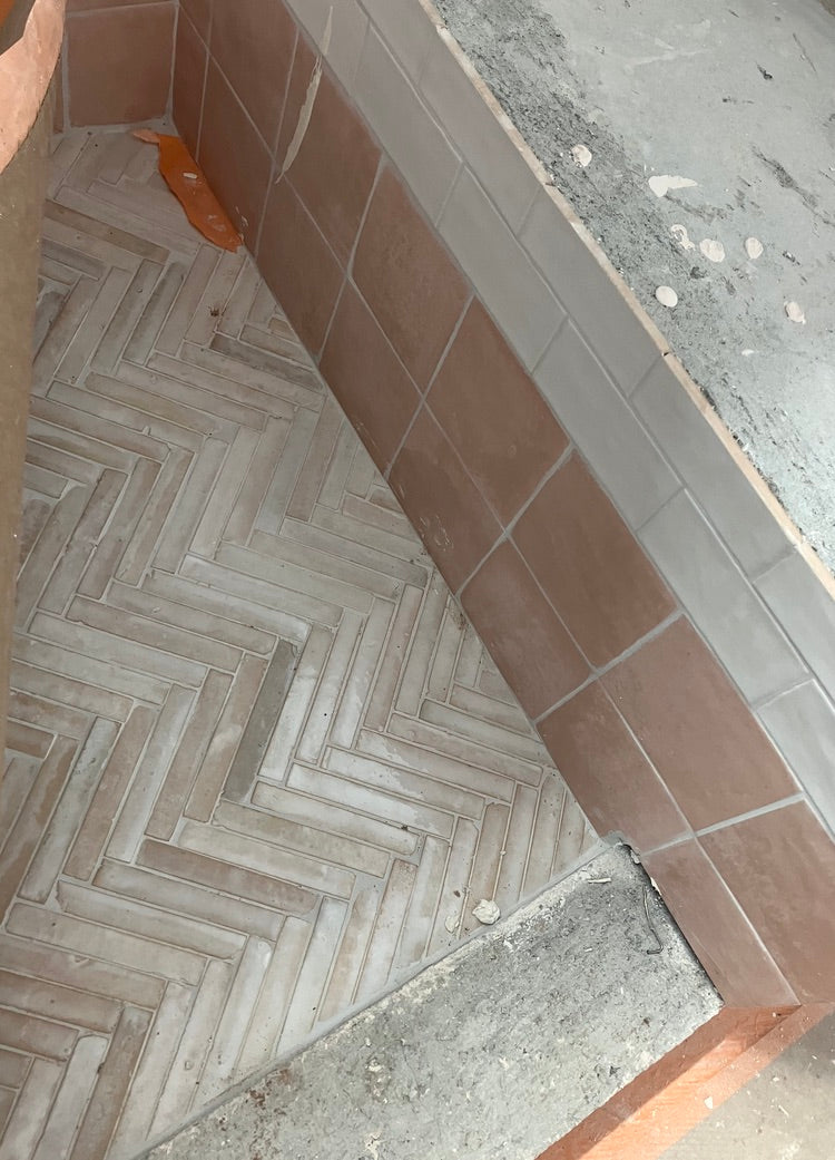 Dover Shores Project herringbone brick floor transitioning to terracotta exterior tile with concrete threshold detail