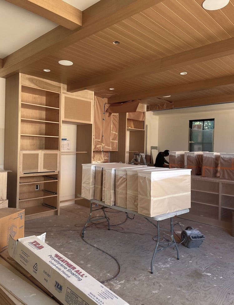 Dover Shores Project kitchen construction showing rift cut white oak ceiling with exposed beams and custom white oak millwork