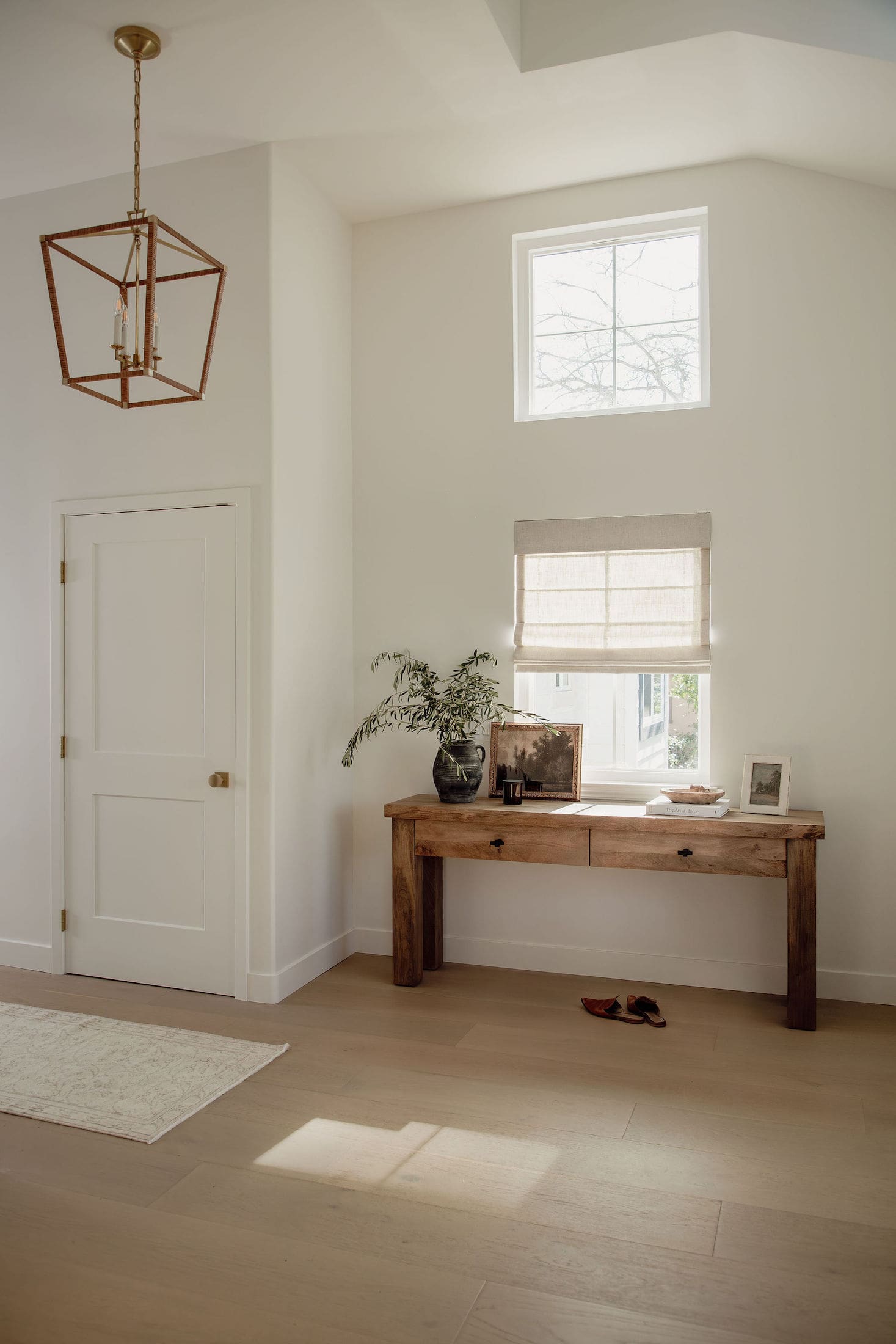 Light-filled estate foyer with lantern pendant from the Thousand Oaks project — Joey Snow Design Co., serving Rancho Santa Fe, California.